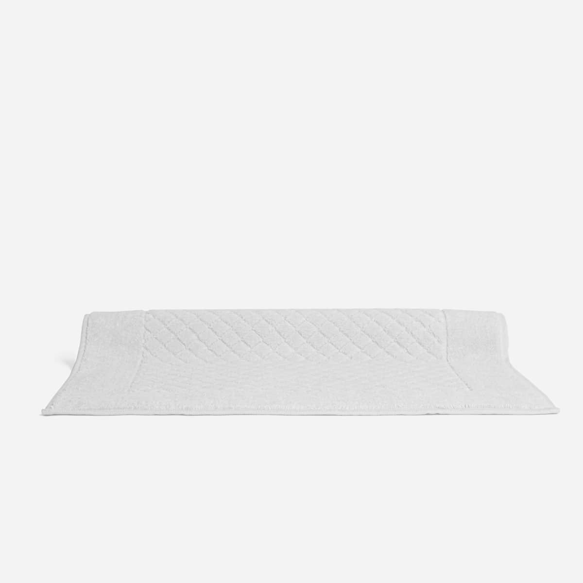 Comment laver et faire sécher un tapis de bain